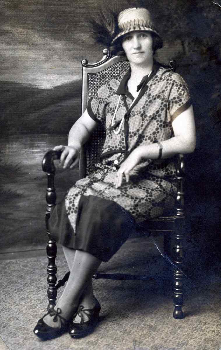 Bertha Goodman sitting in a chair